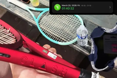 Tennis racket and ball on a court